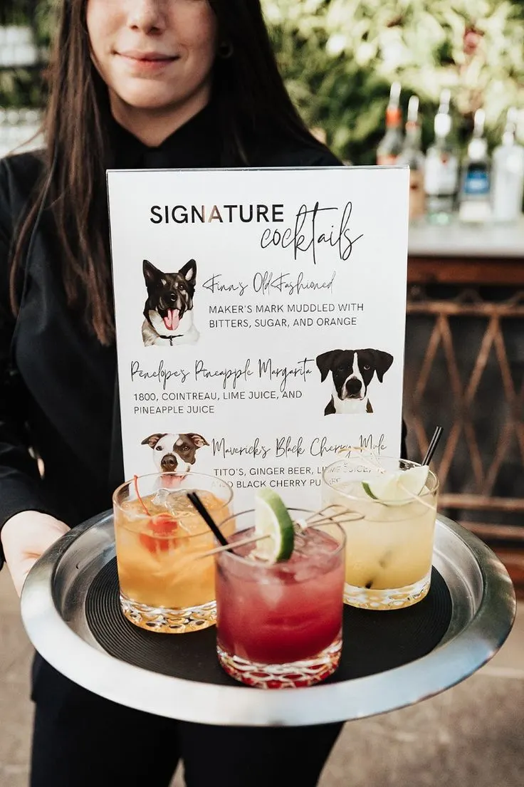 hostess holding tray of wedding cocktails and custom dog menu