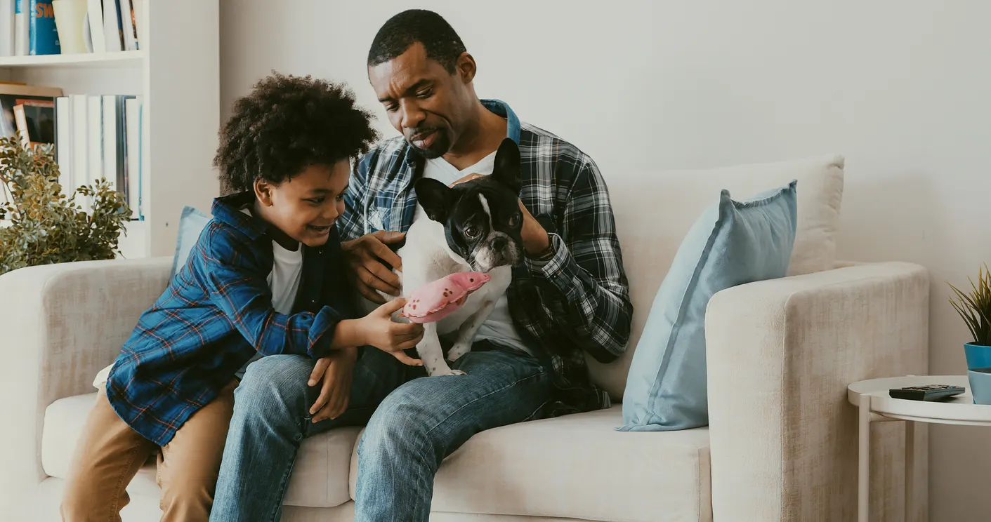 dog dad with child on couch