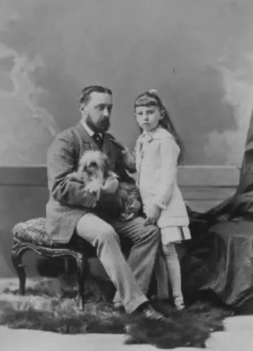 photo of a father with his daughter and small dog