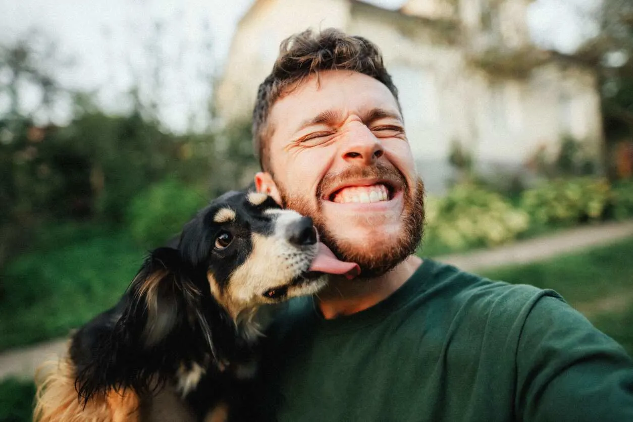 Man smiling with dog