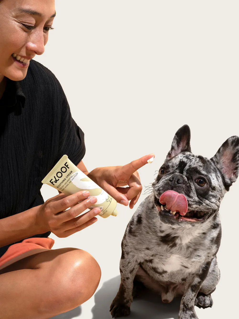 Dog getting paws rubbed with soothing cream