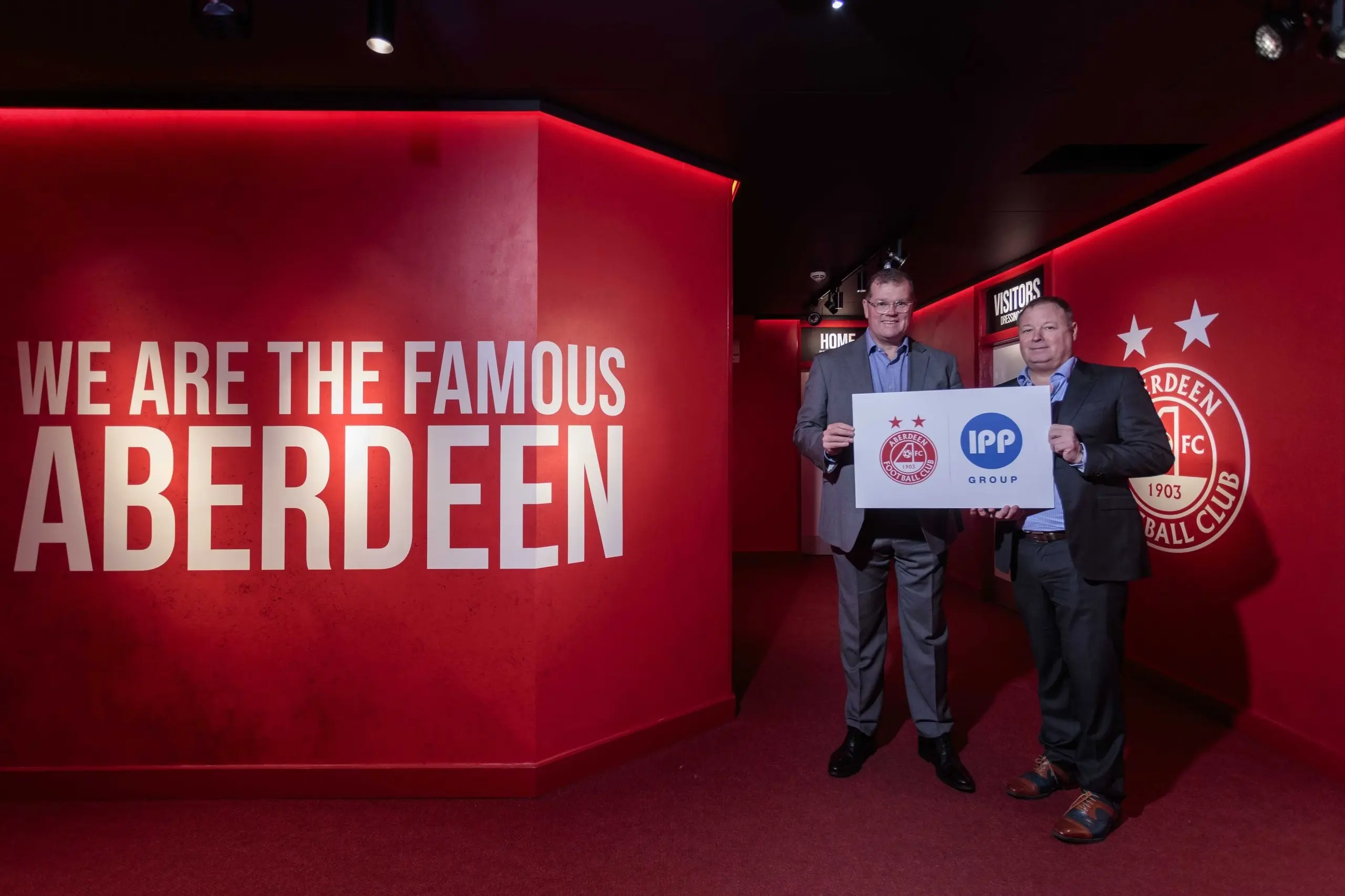 Rob Wicks, Commercial Director of Aberdeen FC with Group CEO of IPP Group, Jared Ayres inside Pittrodrie Stadium at the launch of the partnership announcement