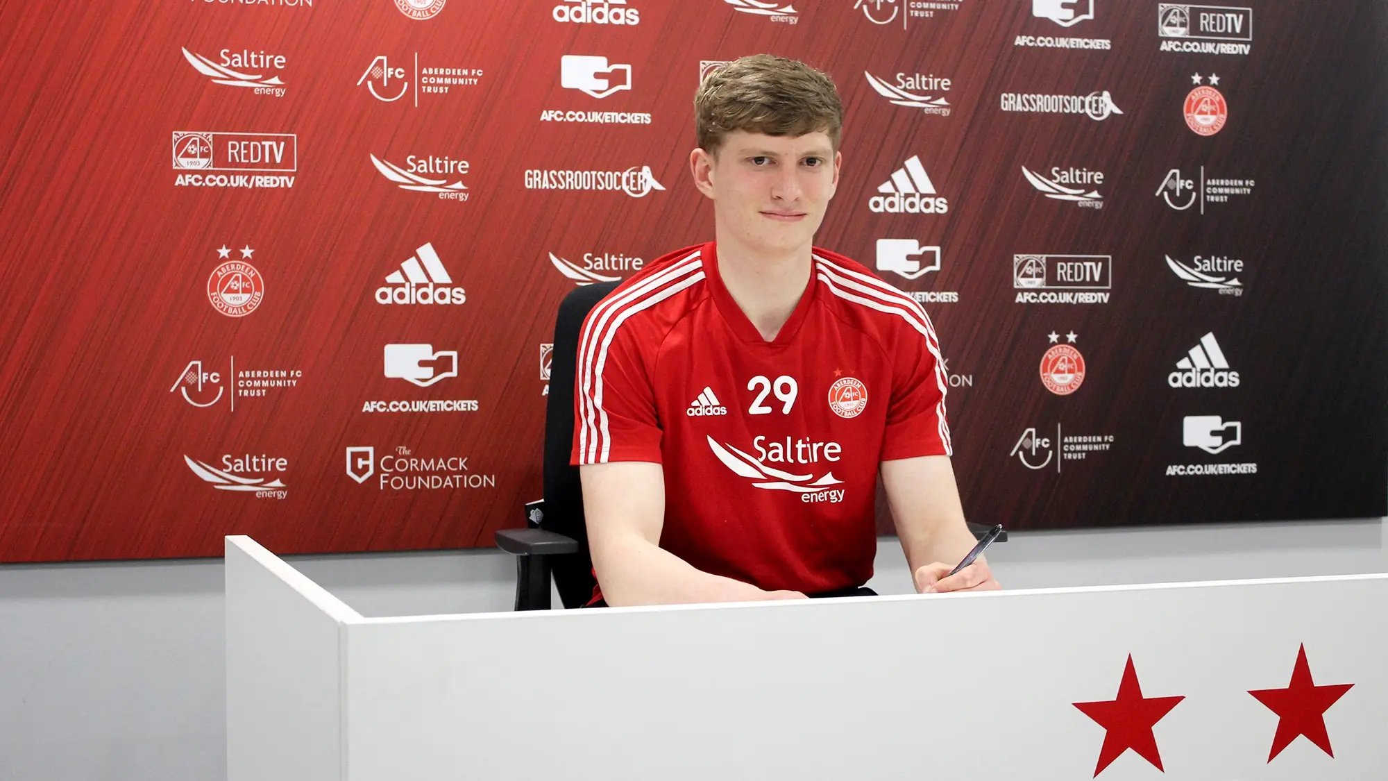 Defender Jack MacKenzie signs new deal