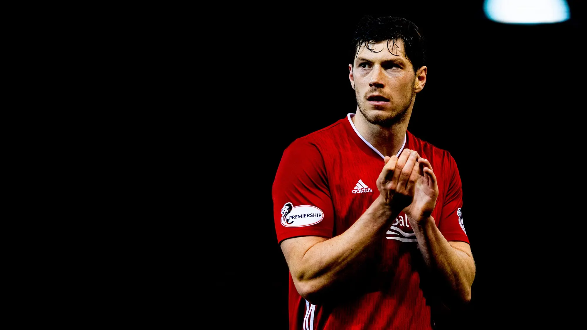 Scott McKenna departs the Dons