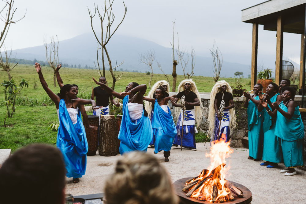 Gathering around a fire to appreciate the song and dance traditions of each region allows guests to engage with its heritage and culture 