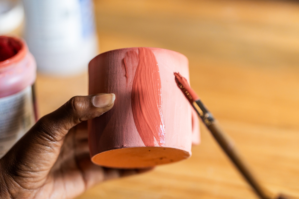 Guests visiting Singita Volcanoes National Park can try their hand at pottery and painting – Theophile takes classes at the on-site studio 