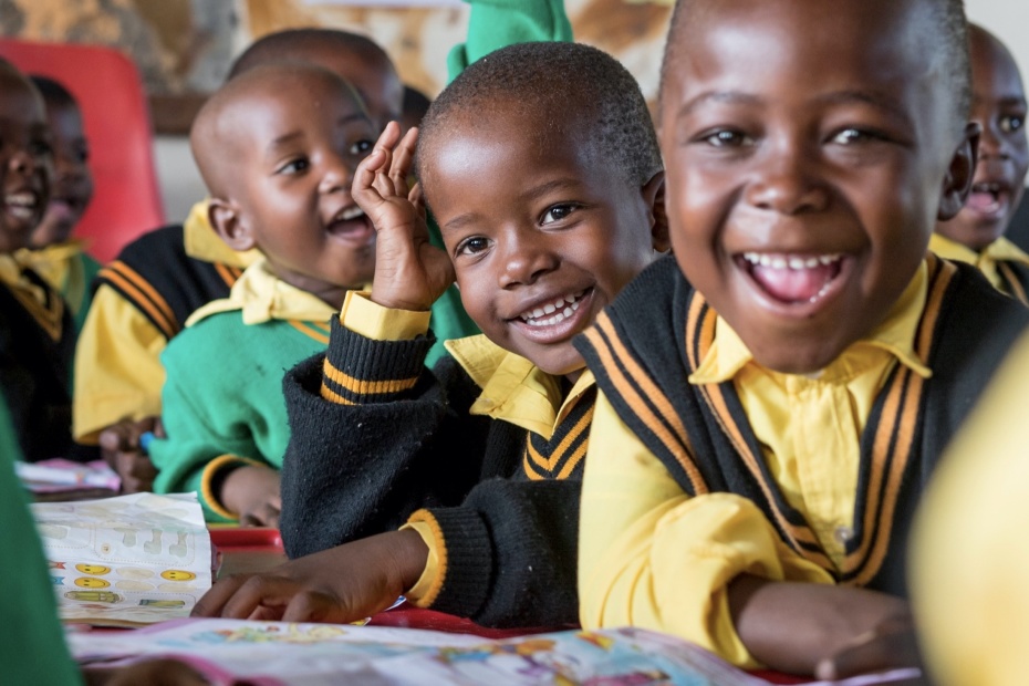 Smiling schoolchildren sitting in class