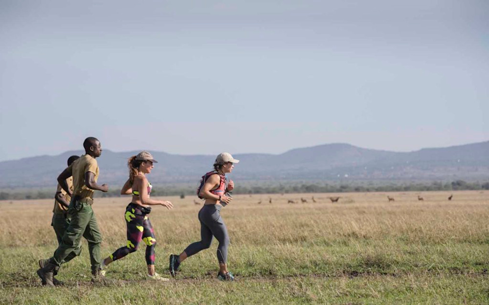 Marietta makes her way across the Serengeti on foot, accompanied by an armed anti-poaching scout from the Grumeti Fund who was on the lookout for overly curious wildlife!