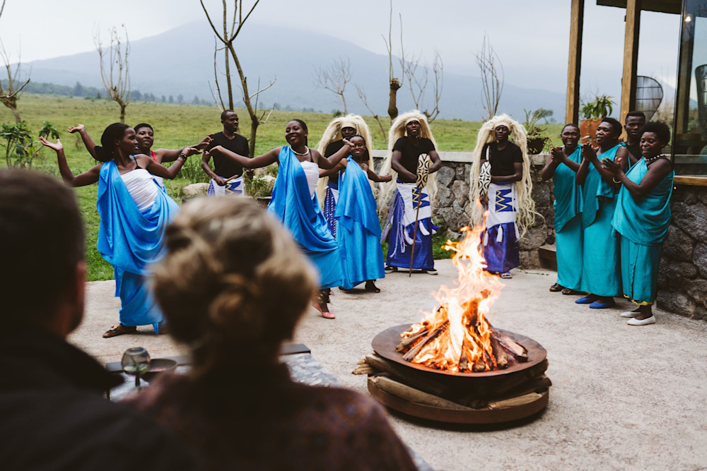Group of women singing around a fire