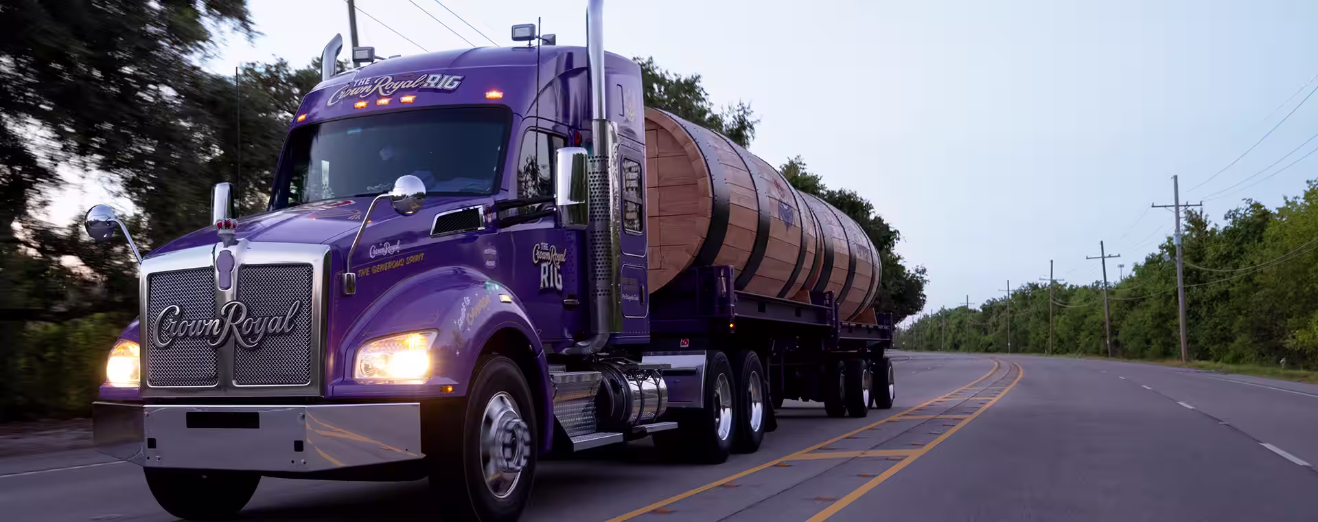 Kane Brown standing in front of The Crown Royal 18 wheeler