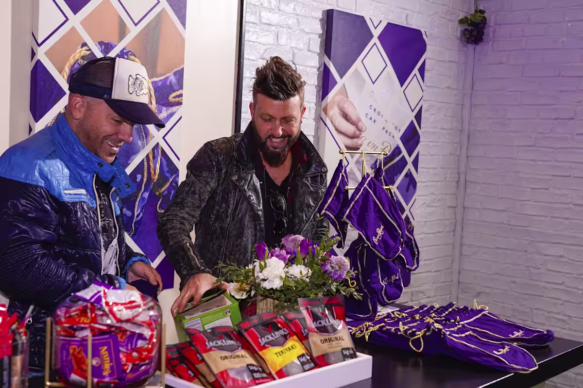 they are looking at a table with a bunch of gifts
