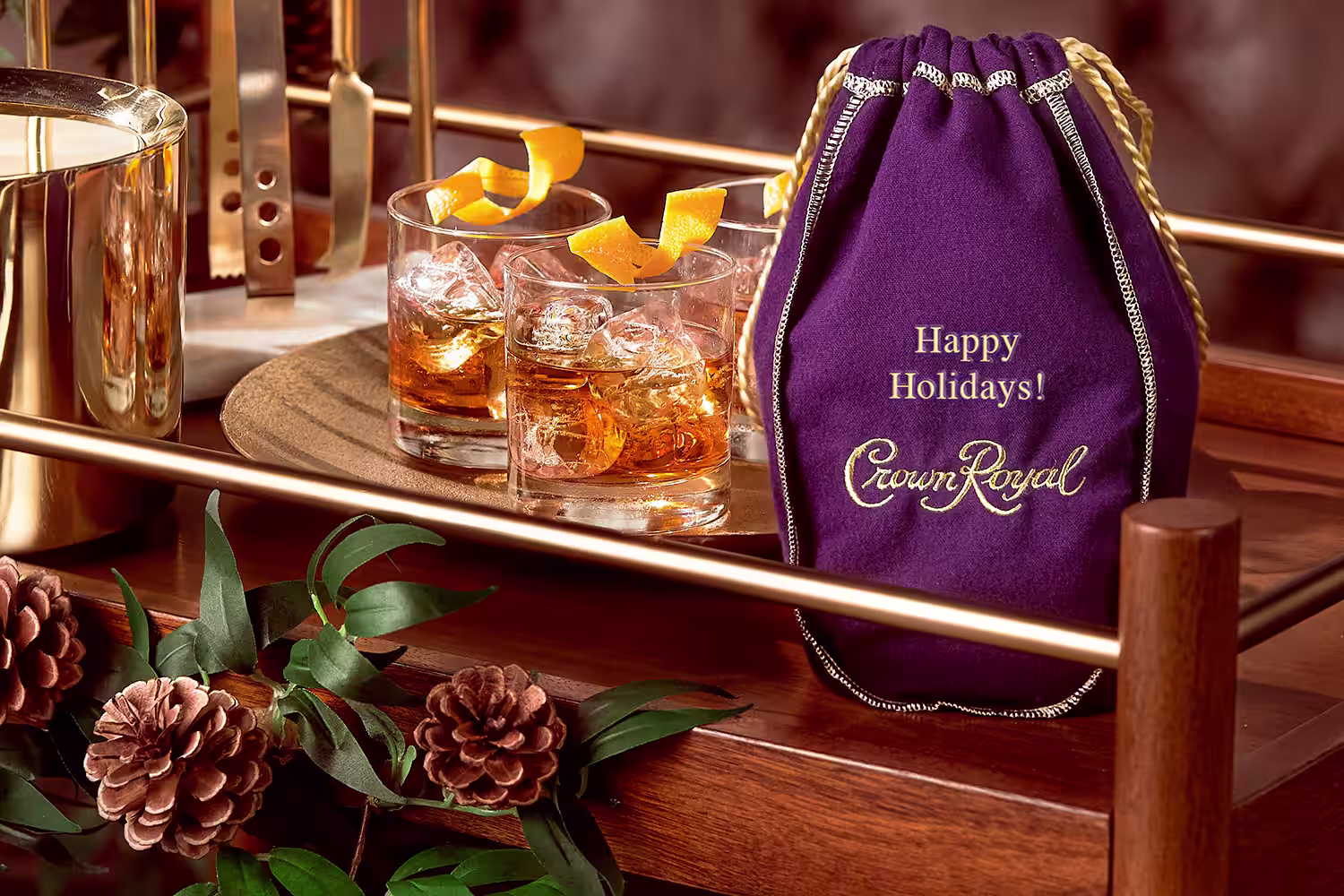 A engraved Crown Royal Purple bag with 'Happy Holidays!'