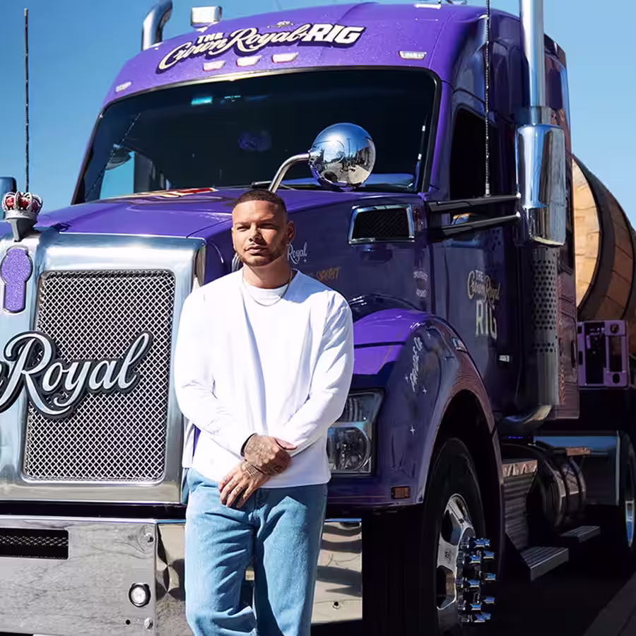 Kane Brown standing in front of the Crown Royal Rig