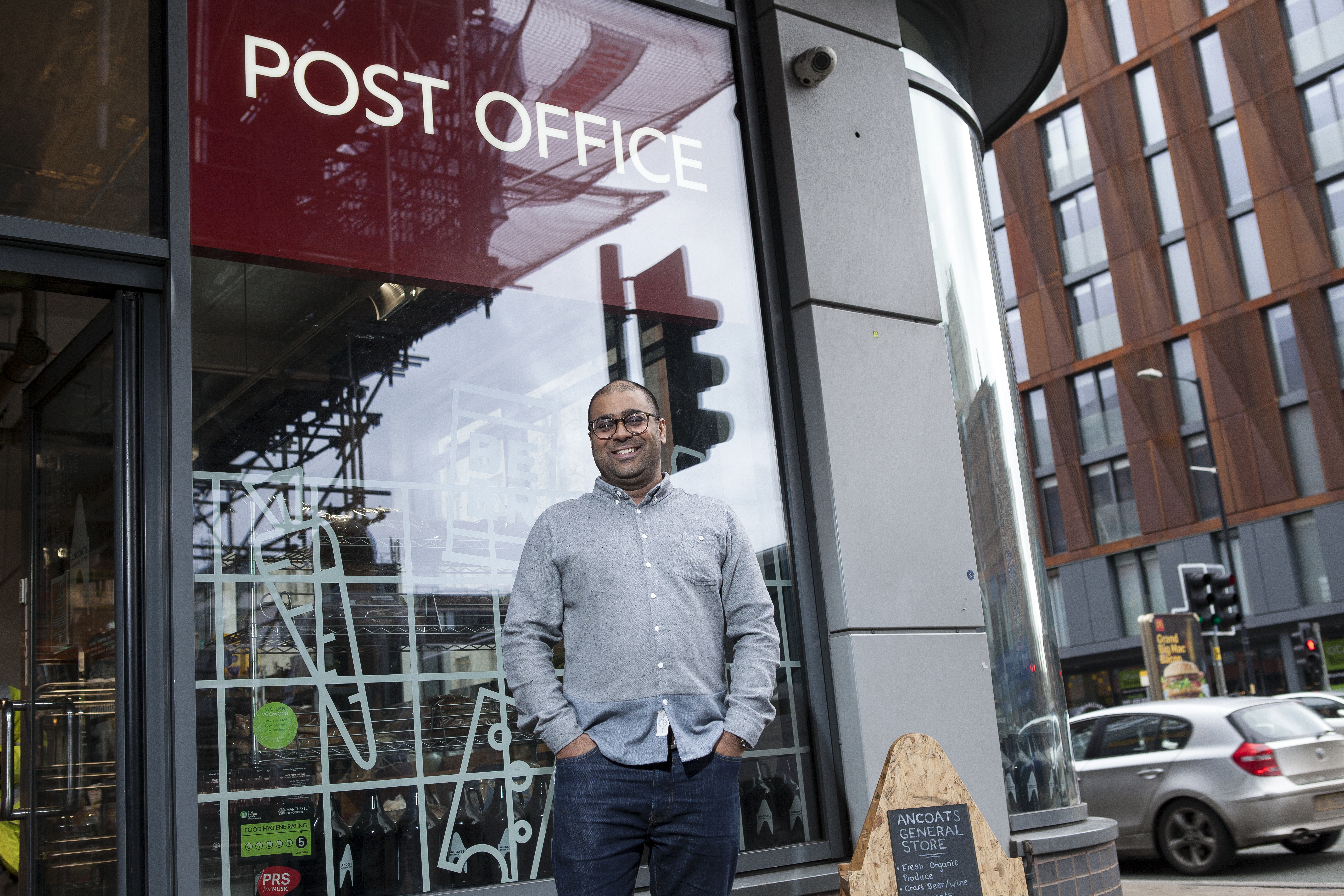 Mital Morar standing in front of his Post Office branch