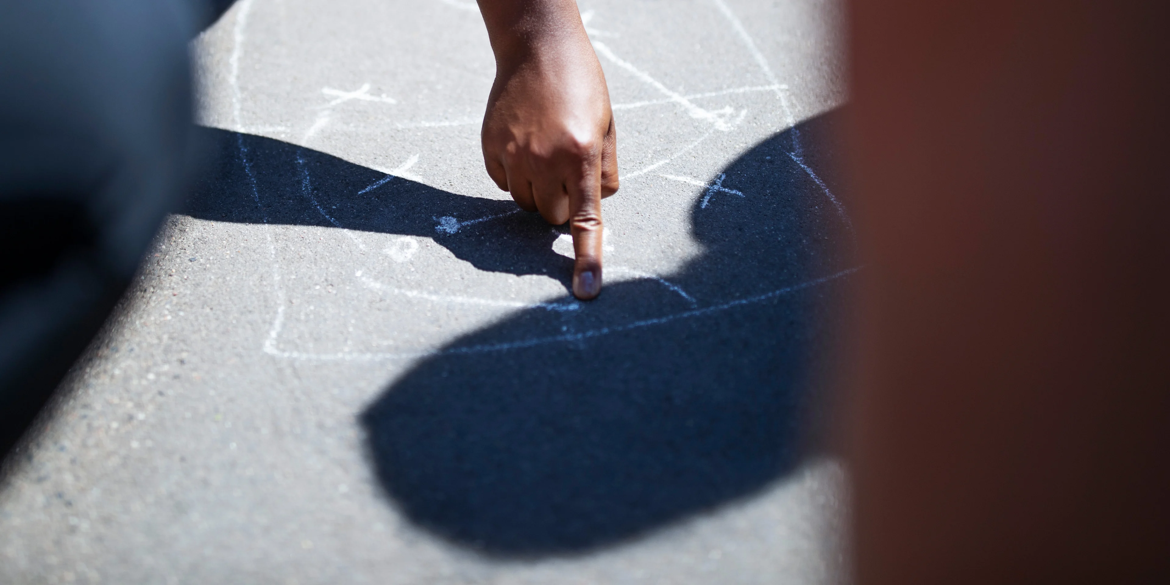 A person drawing an image on the street