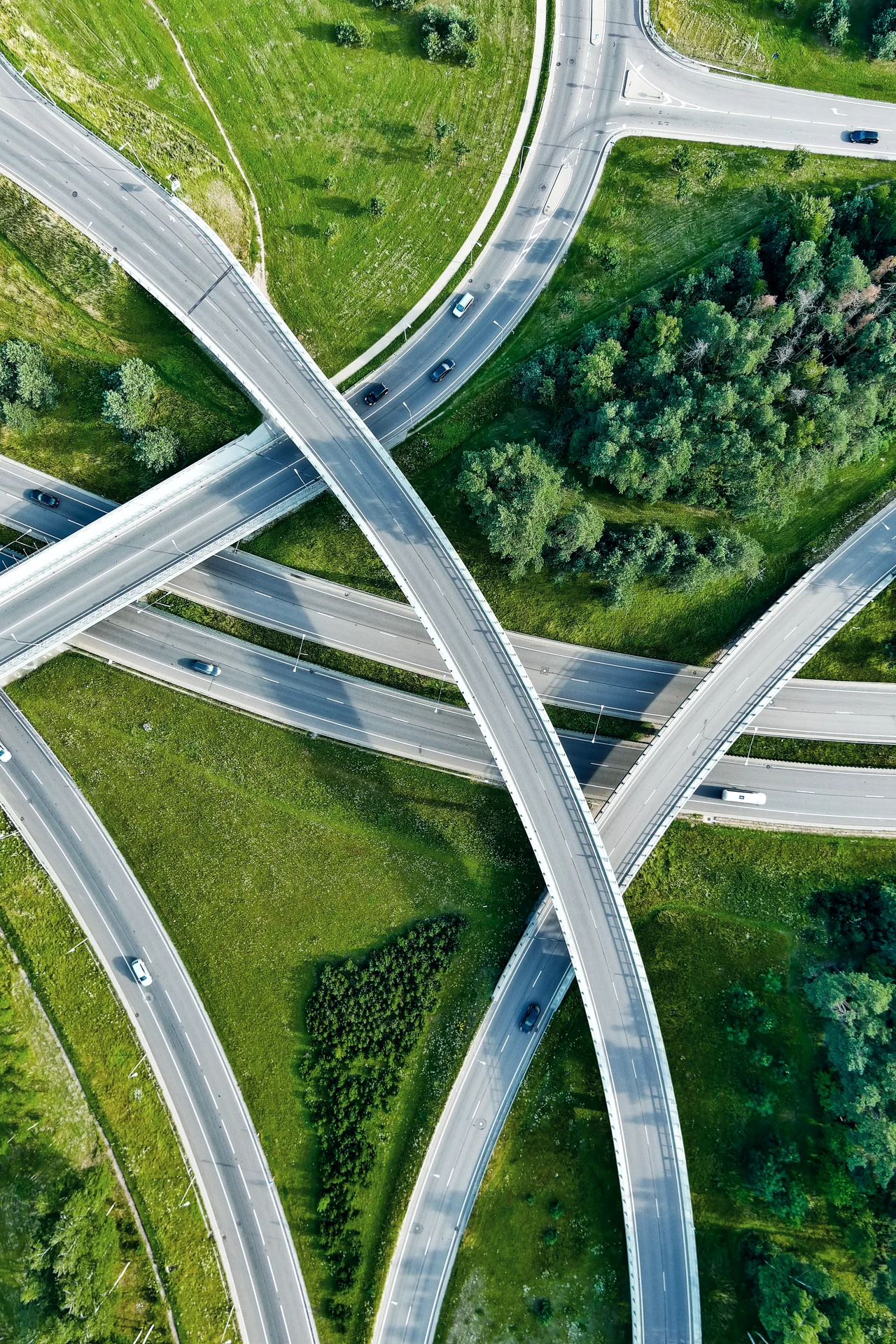 Aerial view of a road intersection on summer day.