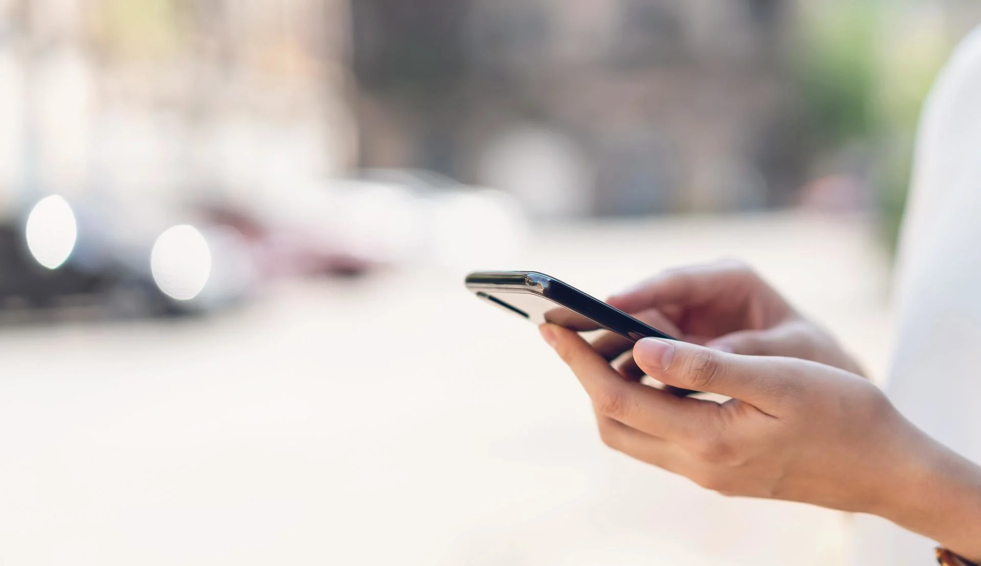 Person holding a mobile phone