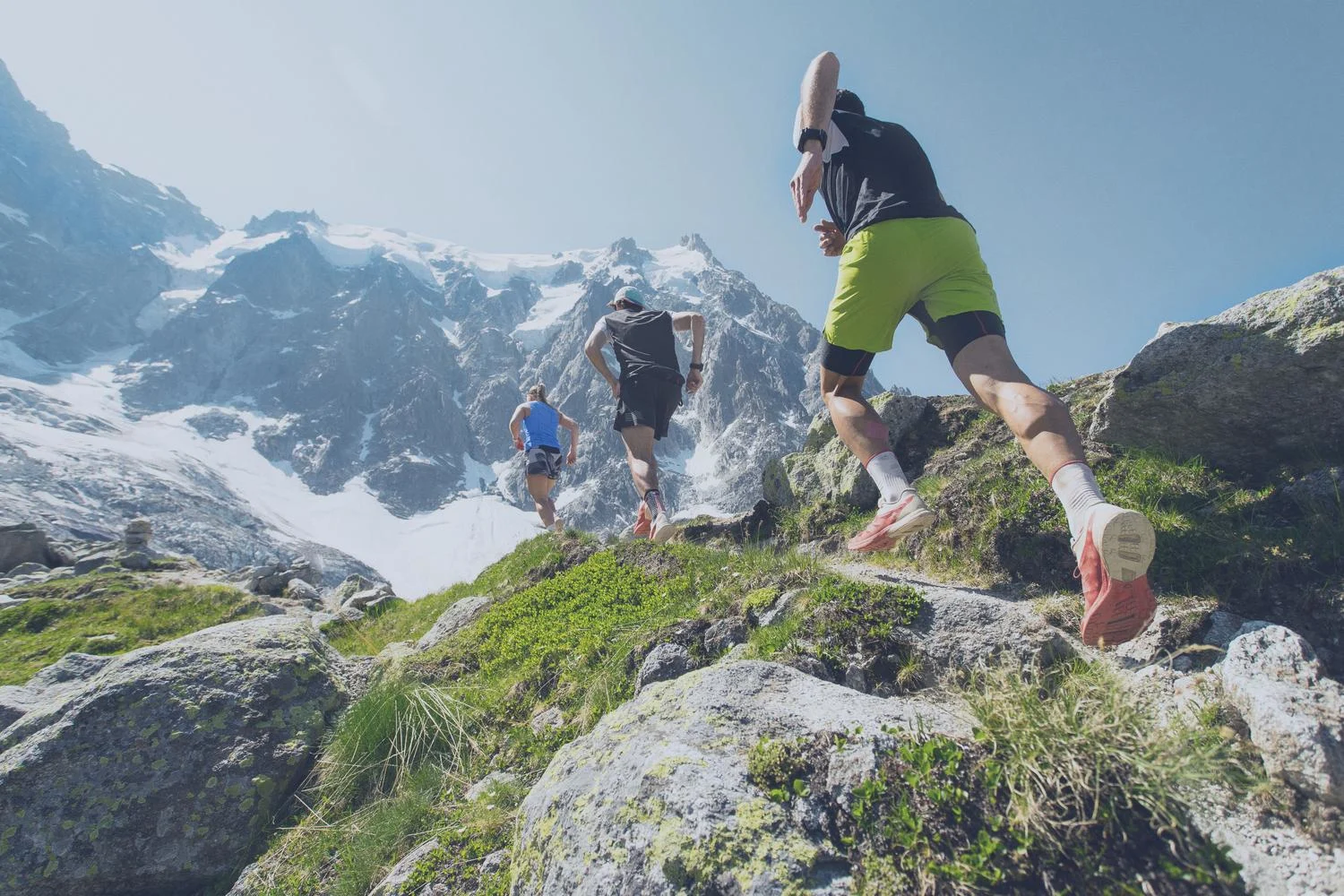 Three people running on the mountains