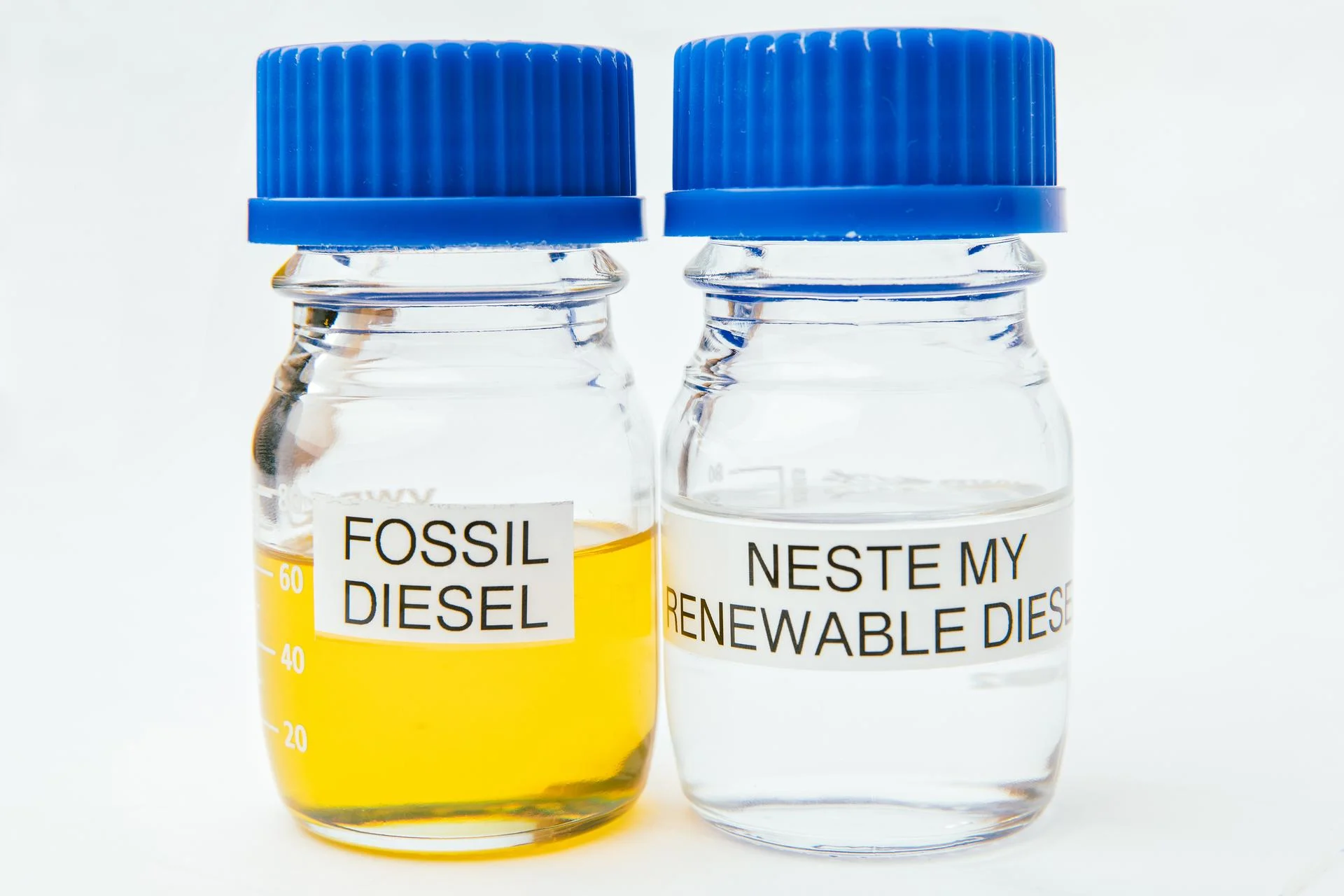Bottles of fossil diesel and Neste MY Renewable Diesel 