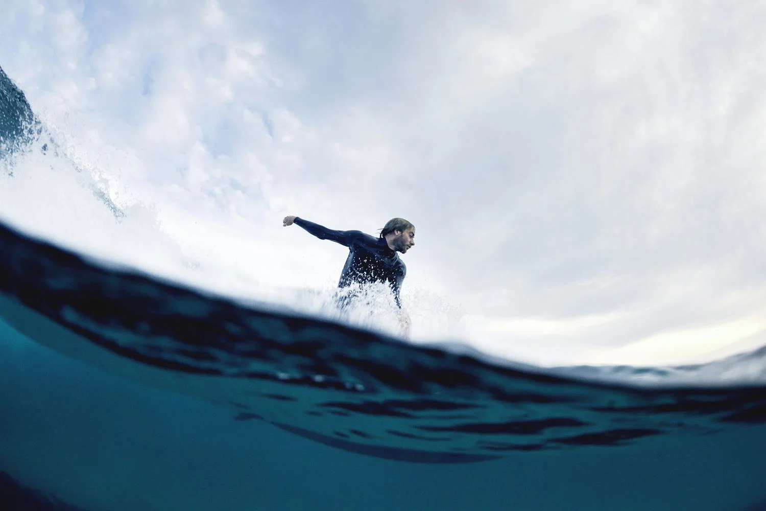 Surfer riding a wave.