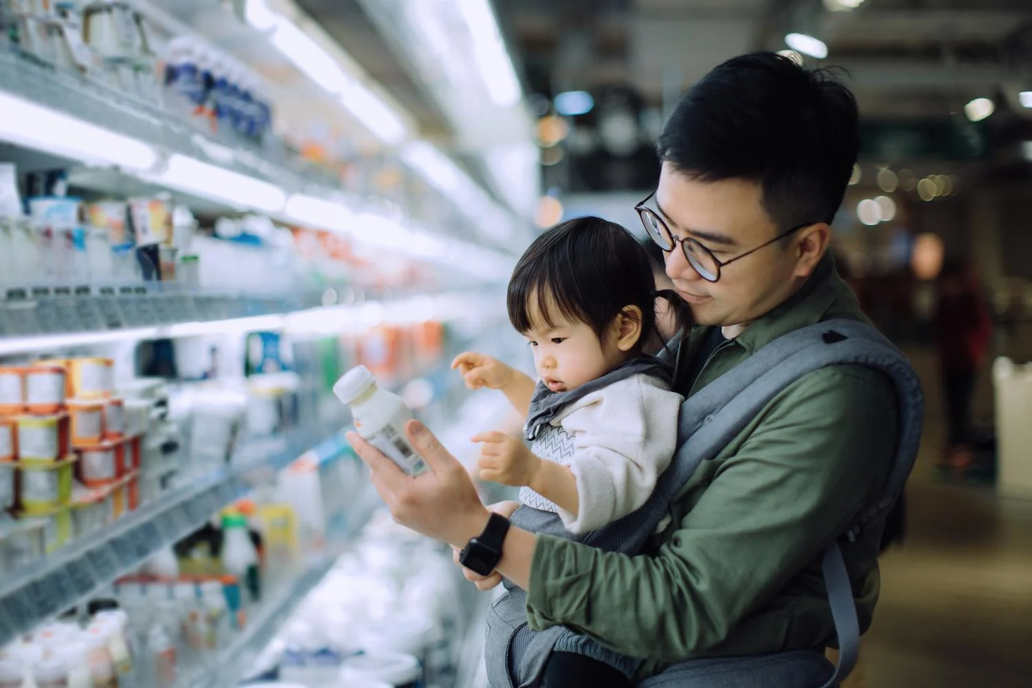 Dad and his baby grocery shopping