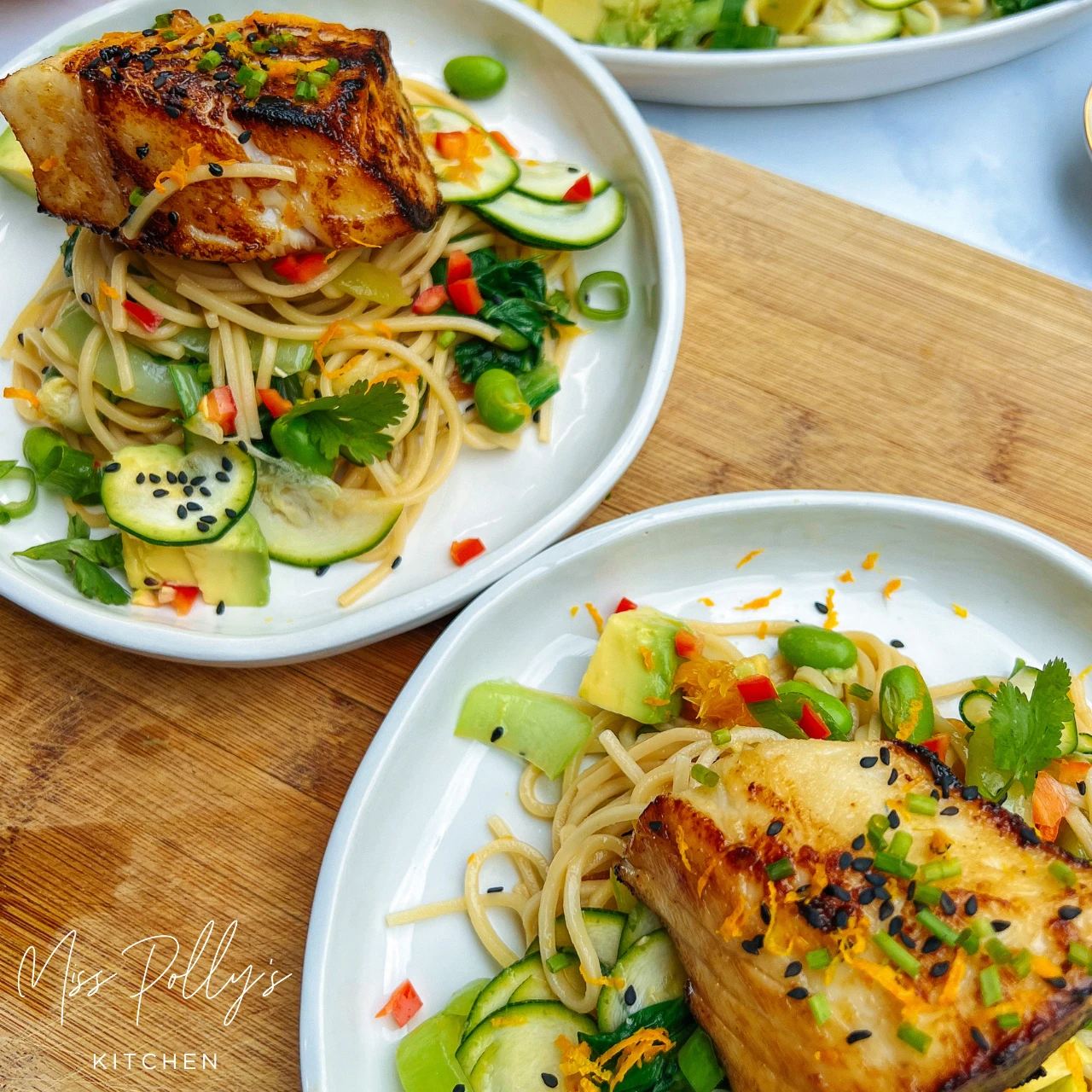 Miso and Honey Glazed Toothfish on noodle salad on marble background