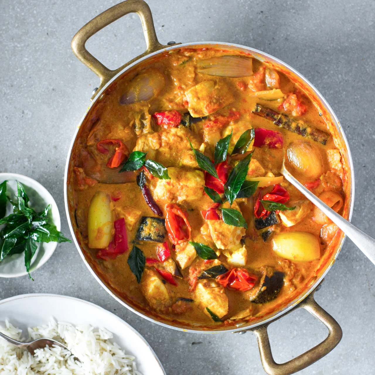 This vibrant curry will warm you up within moments. Served with fragrant coconut and ginger rice, this delicious dish is sure to become a staple in your home cooking repertoire.