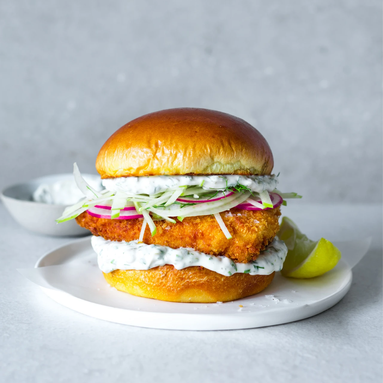 The best fish burger recipe made with panko  breadcrumbs, burger buns and mayonnaise. Serve with homemade chunky chips.
