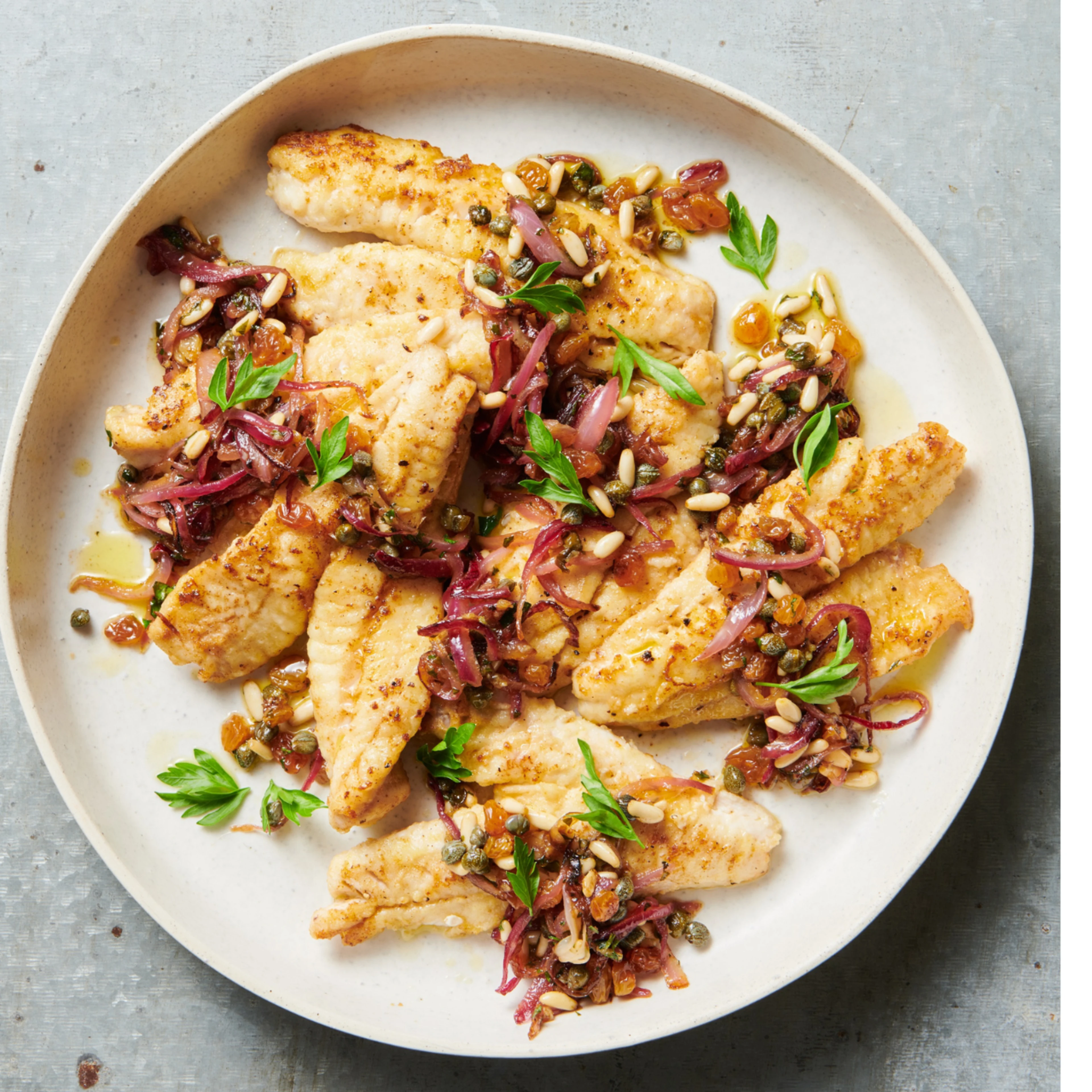 Our delicious Pan-fried Sicilian Fish recipe uses gurnard fish, sultanas, capers and pinenuts. Pan fry or cook in the oven.
