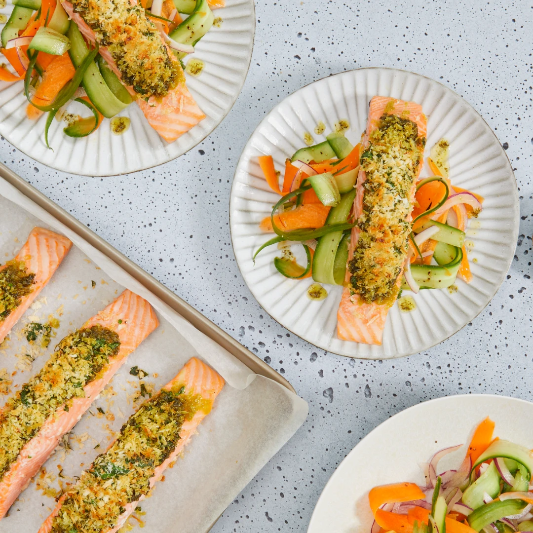Perfect for a quick and healthy weeknight meal, this dish blends lemon zest with freshly chopped herbs into a tasty crumb that’s baked on top of juicy, salsa verde coated, salmon fillets. Served with a crisp ribbon salad, it’s bound to impress everyone around the table. 
