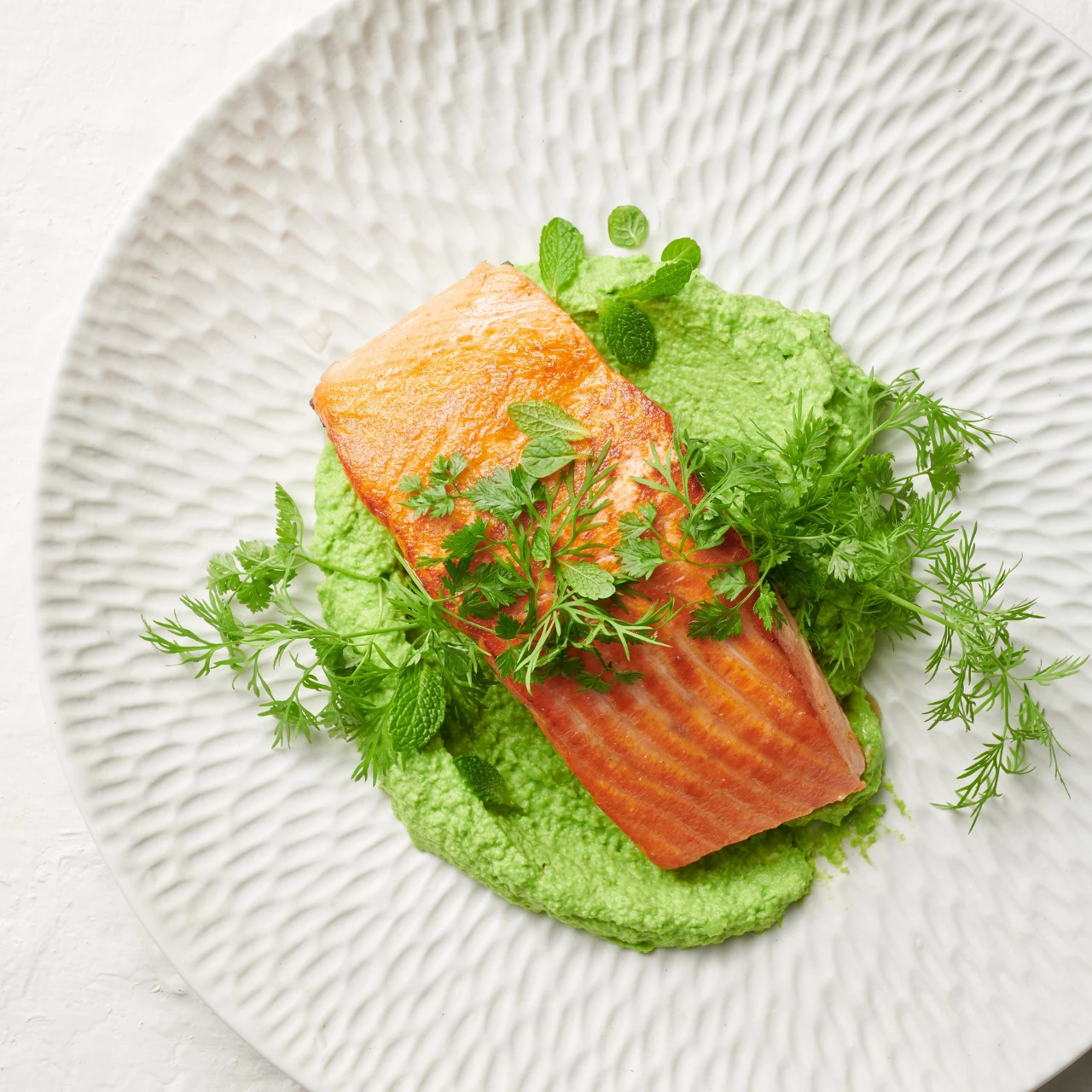 Try our easy NZ King Salmon with Silky Pea Puree recipe with fresh orange juice, mustard dressing and fresh herbs. 