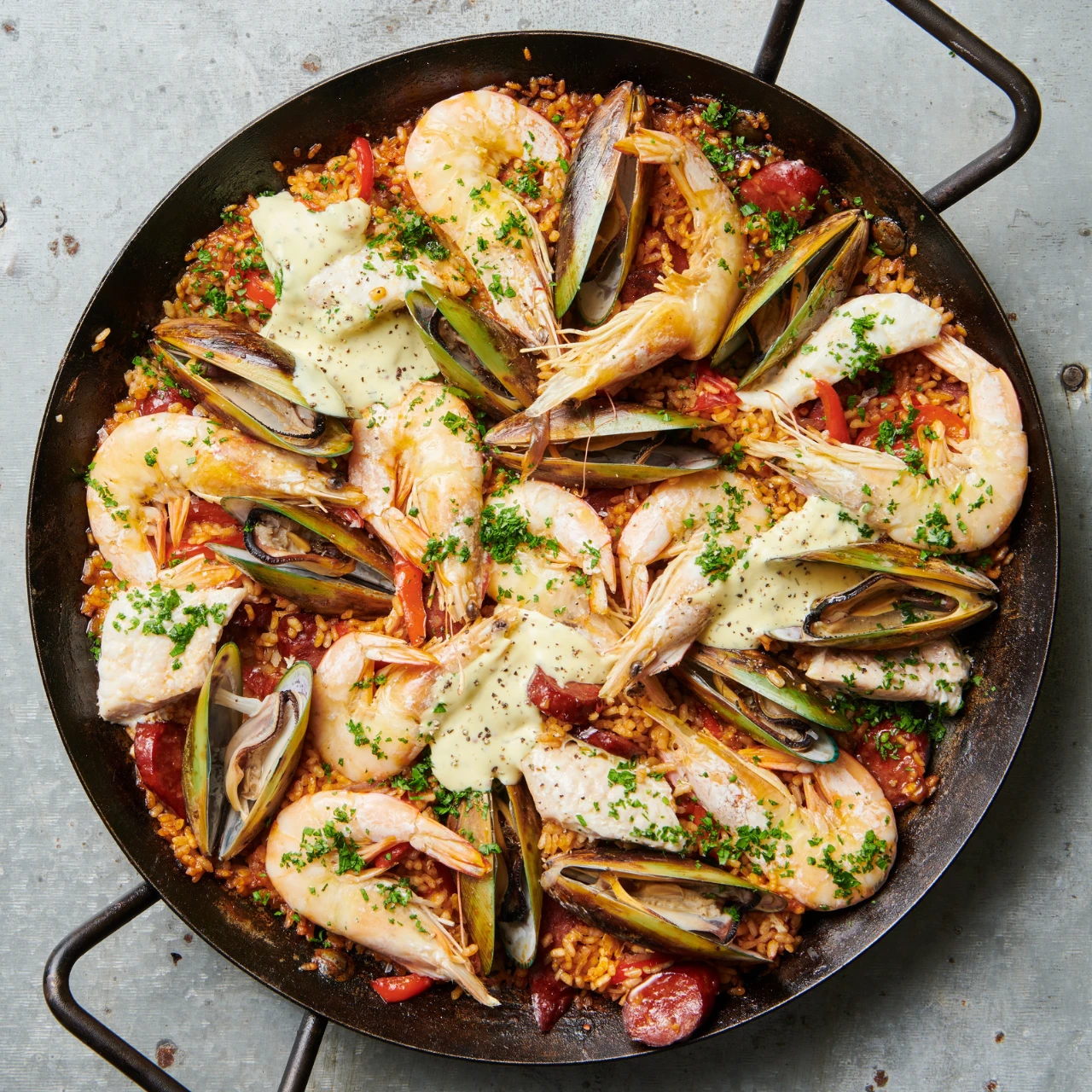 Fish, prawn, greenshell mussels and chorizo paella recipe. Cook our easy Seafood Paella Recipe for your next family dinner!