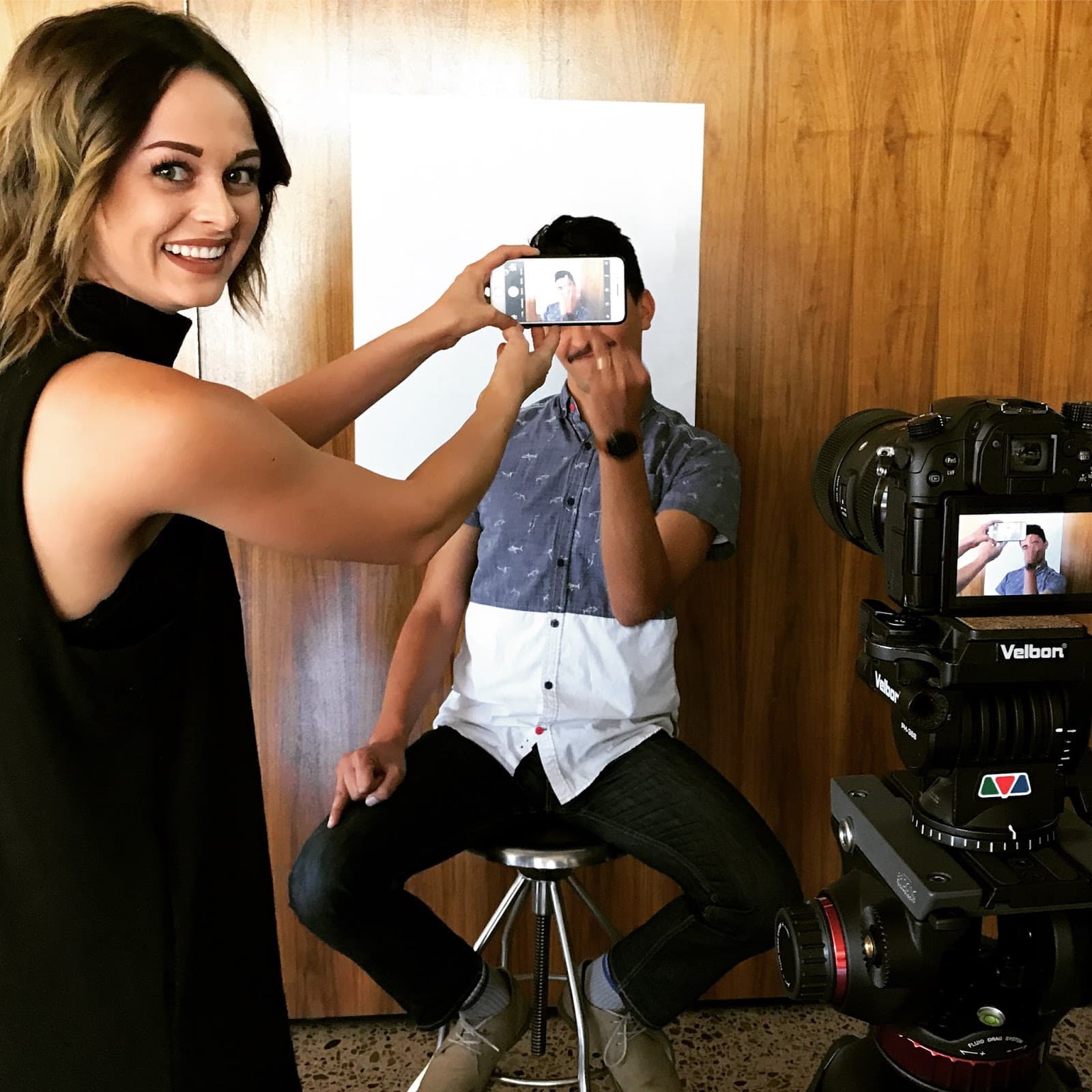 A man flips off a camera.