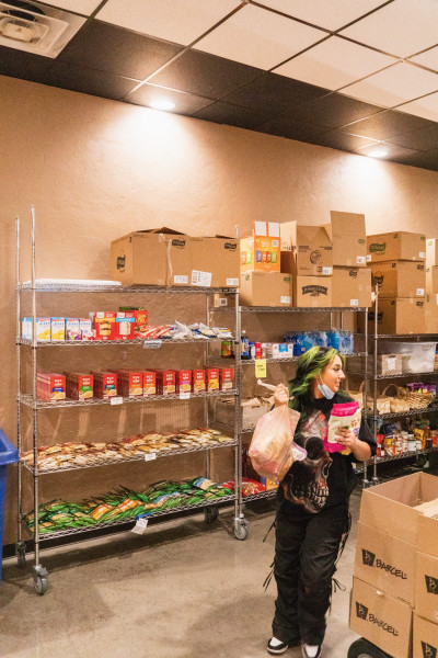 A woman walks with food