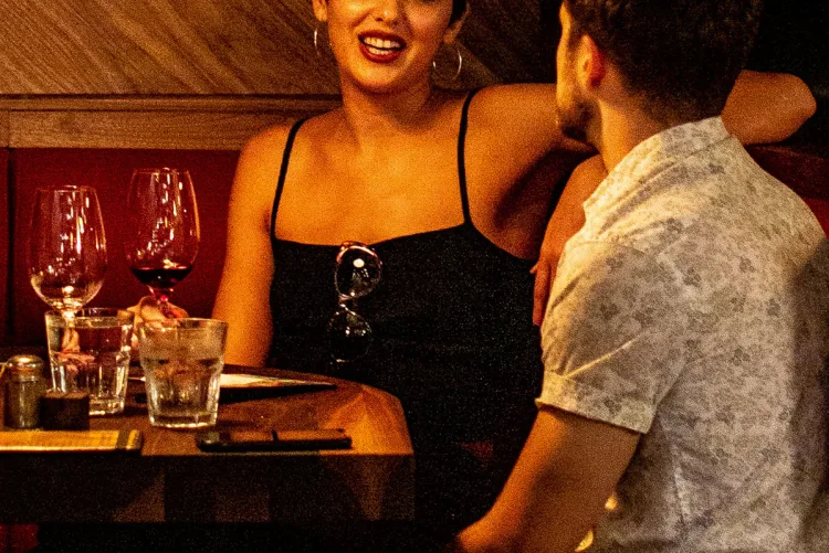 Grainy photo of a man and woman at a restaurant table