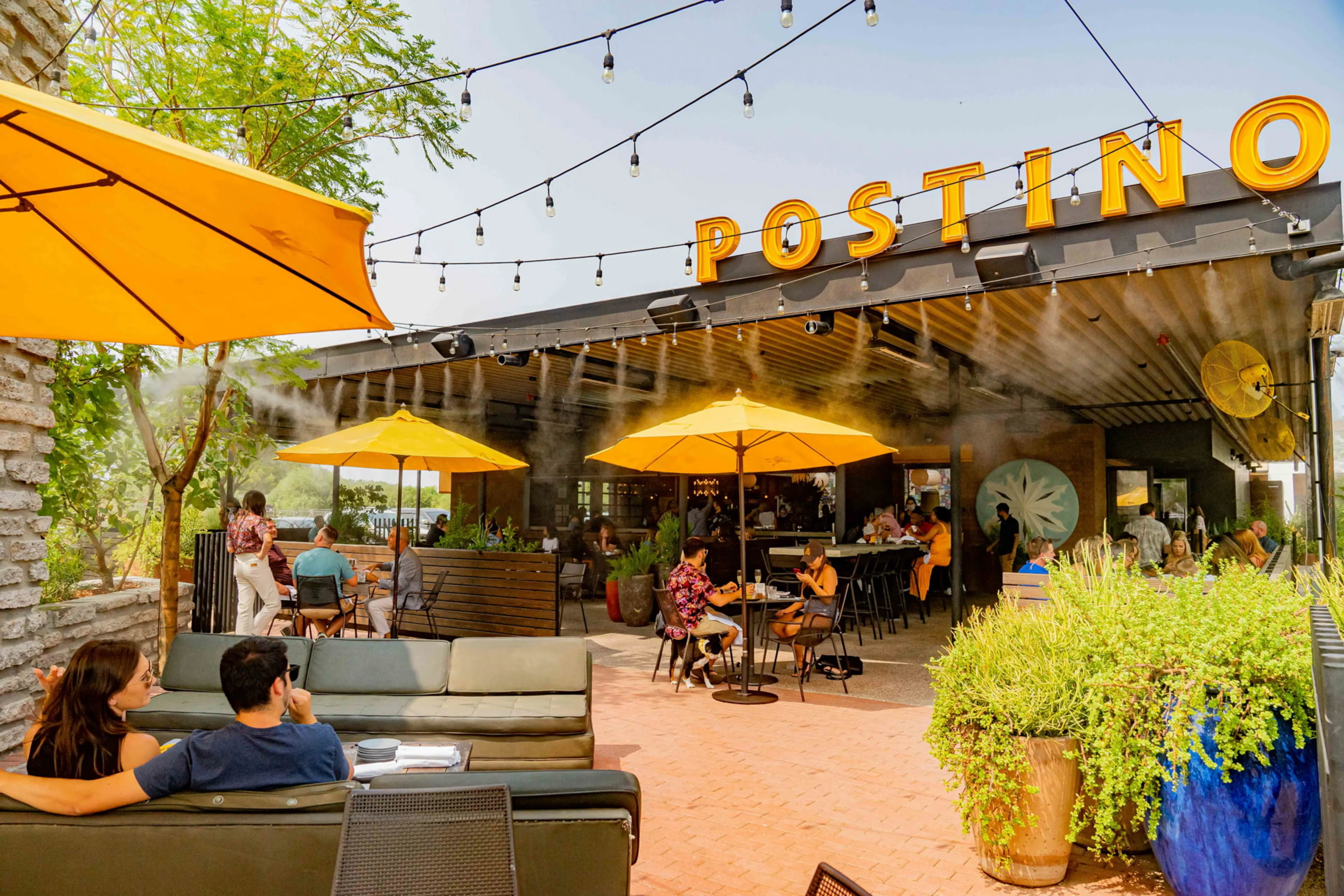 Photo of a postino patio with people dining outside