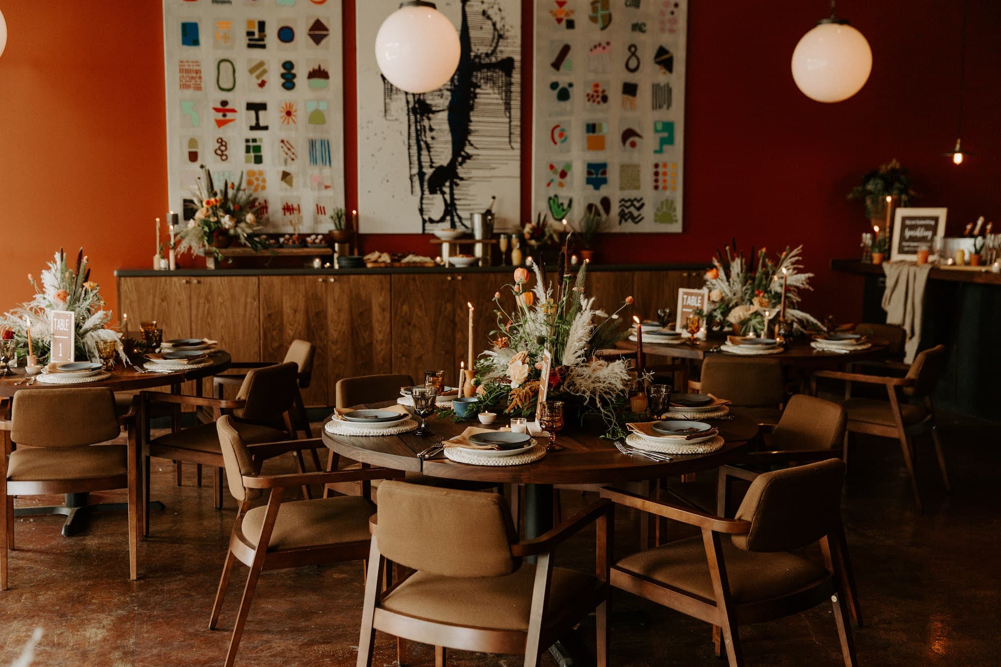 Tables at a wedding set with flowers and candles