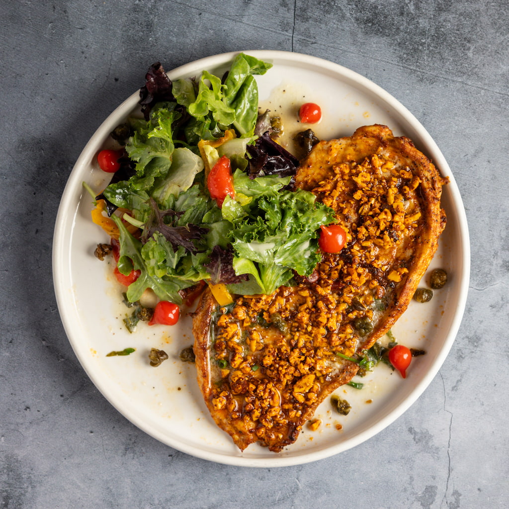 Chicken Paillard with almonds, lemon caper butter, petite salad.
