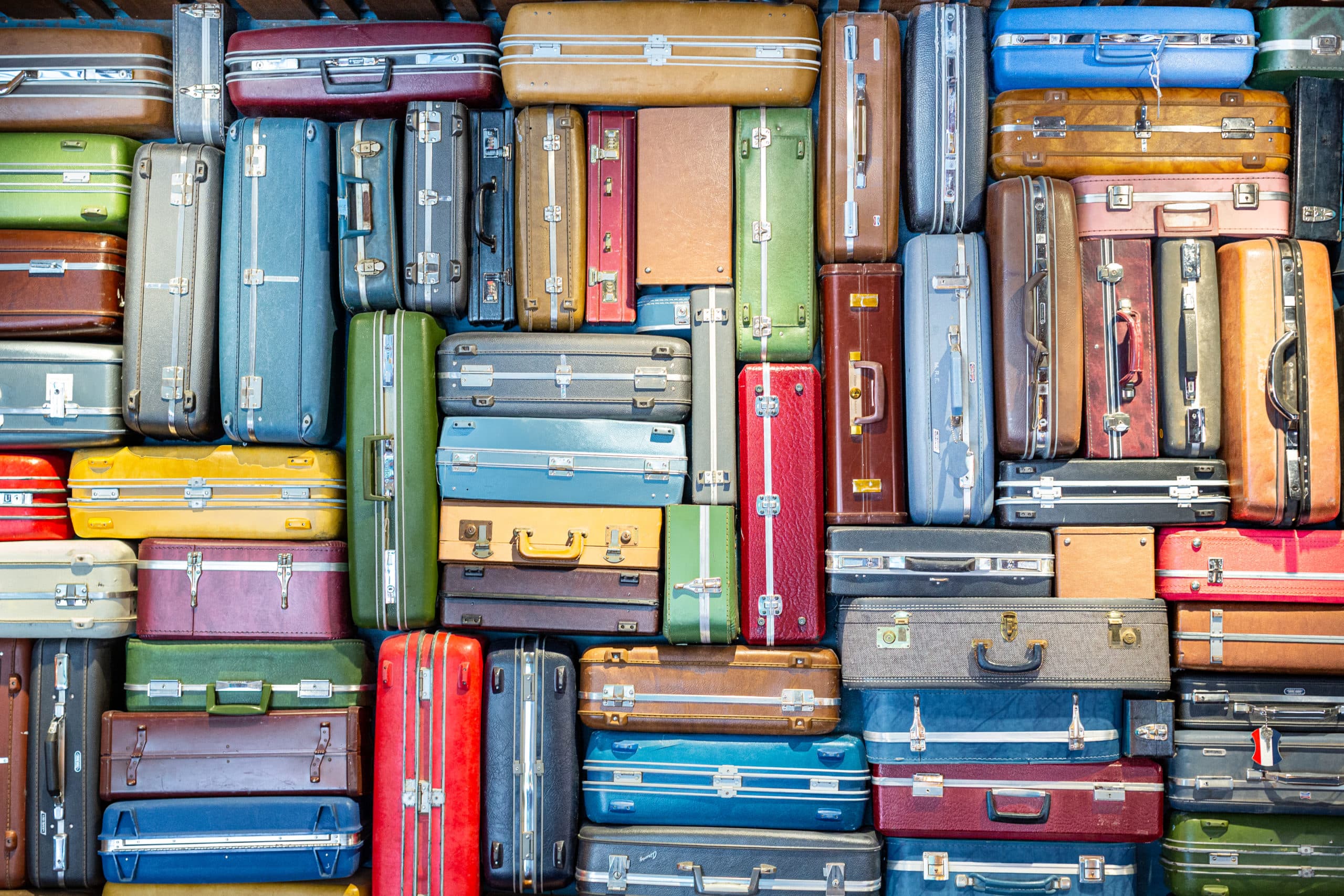 Colorful suitcases stacked 