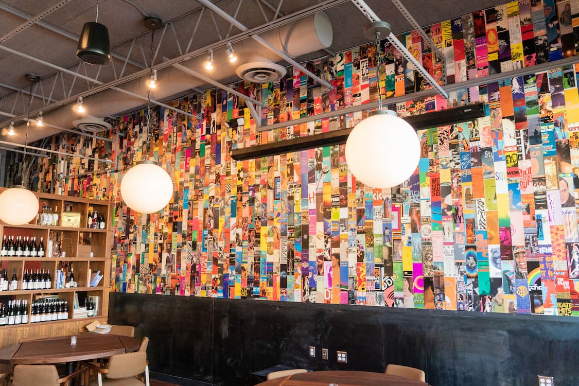 A wall covered in colorful art.