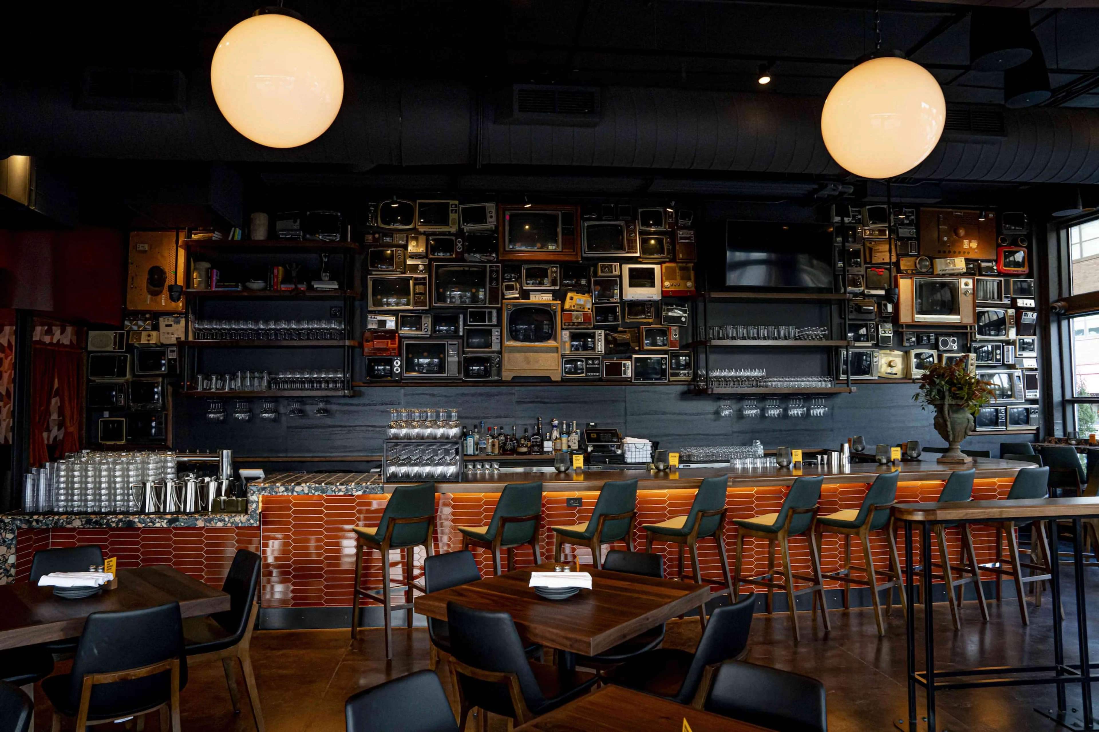 Postino 12 South's Vintage TV Art Wall and Bar