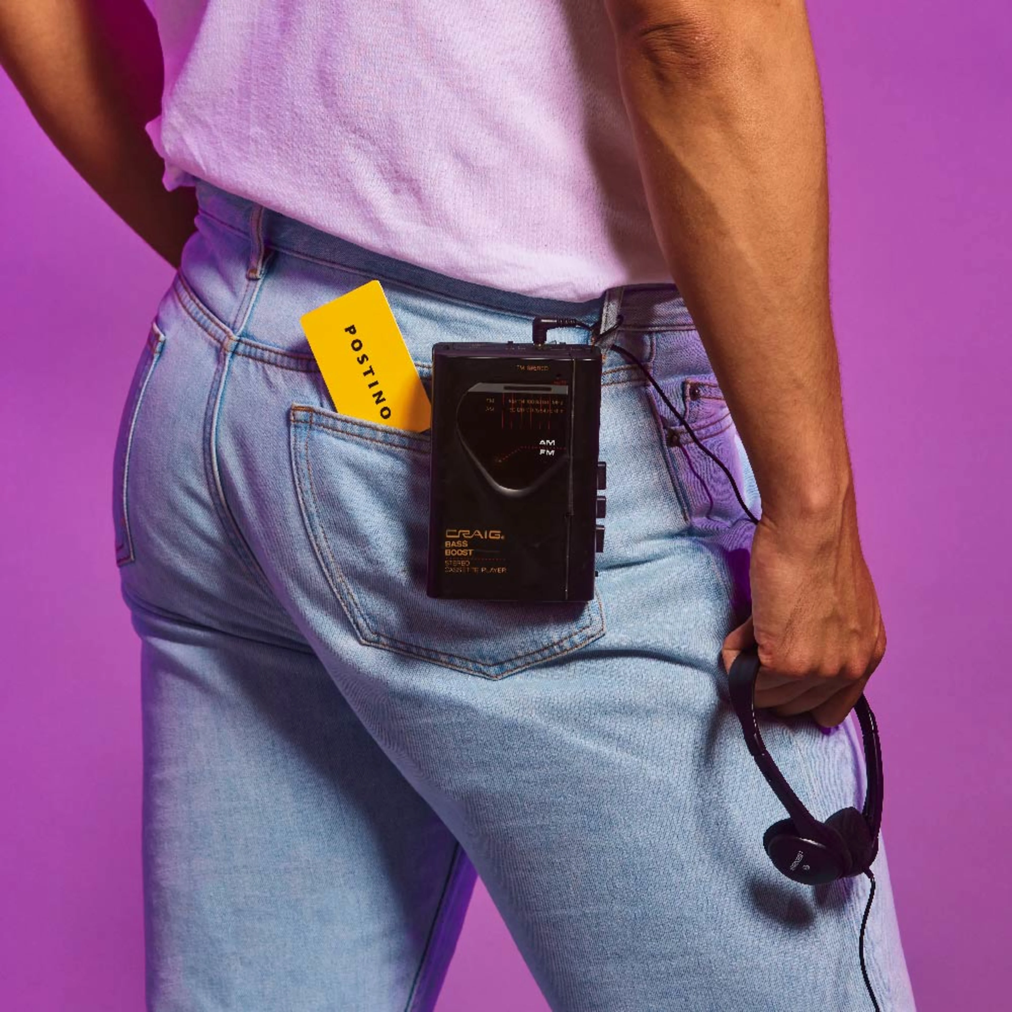 Postino gift card sticking out of a man's back pocket