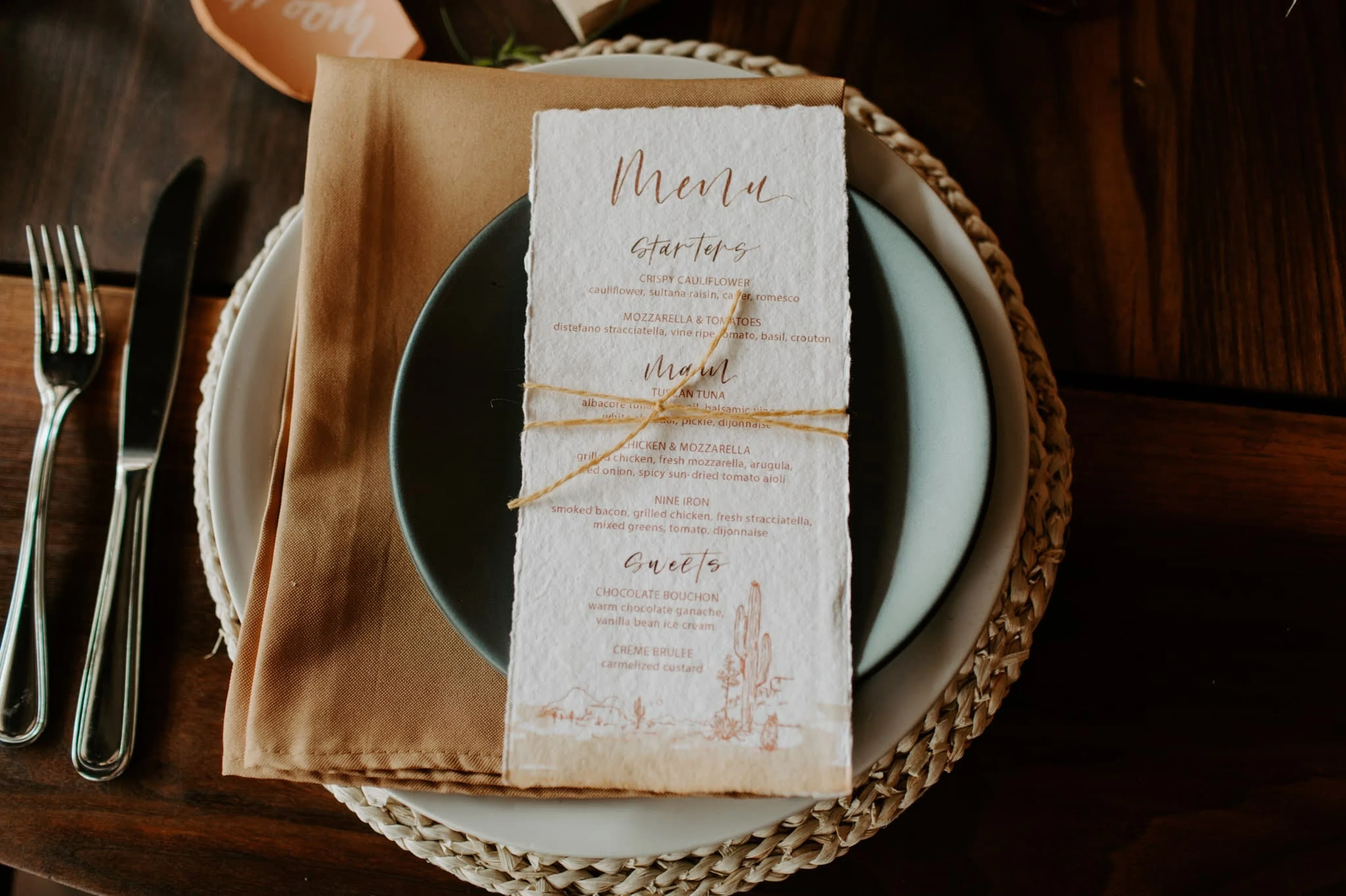 A table setting with a wedding program