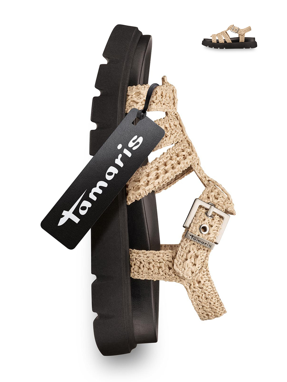 Beige woven women&rsquo;s sandal with a black platform sole and ankle strap, product tag visible.