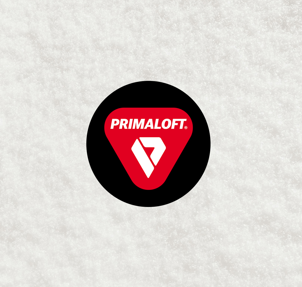 PrimaLoft logo on a black circle: red triangle with white lettering and a stylised P symbol, on a light background.