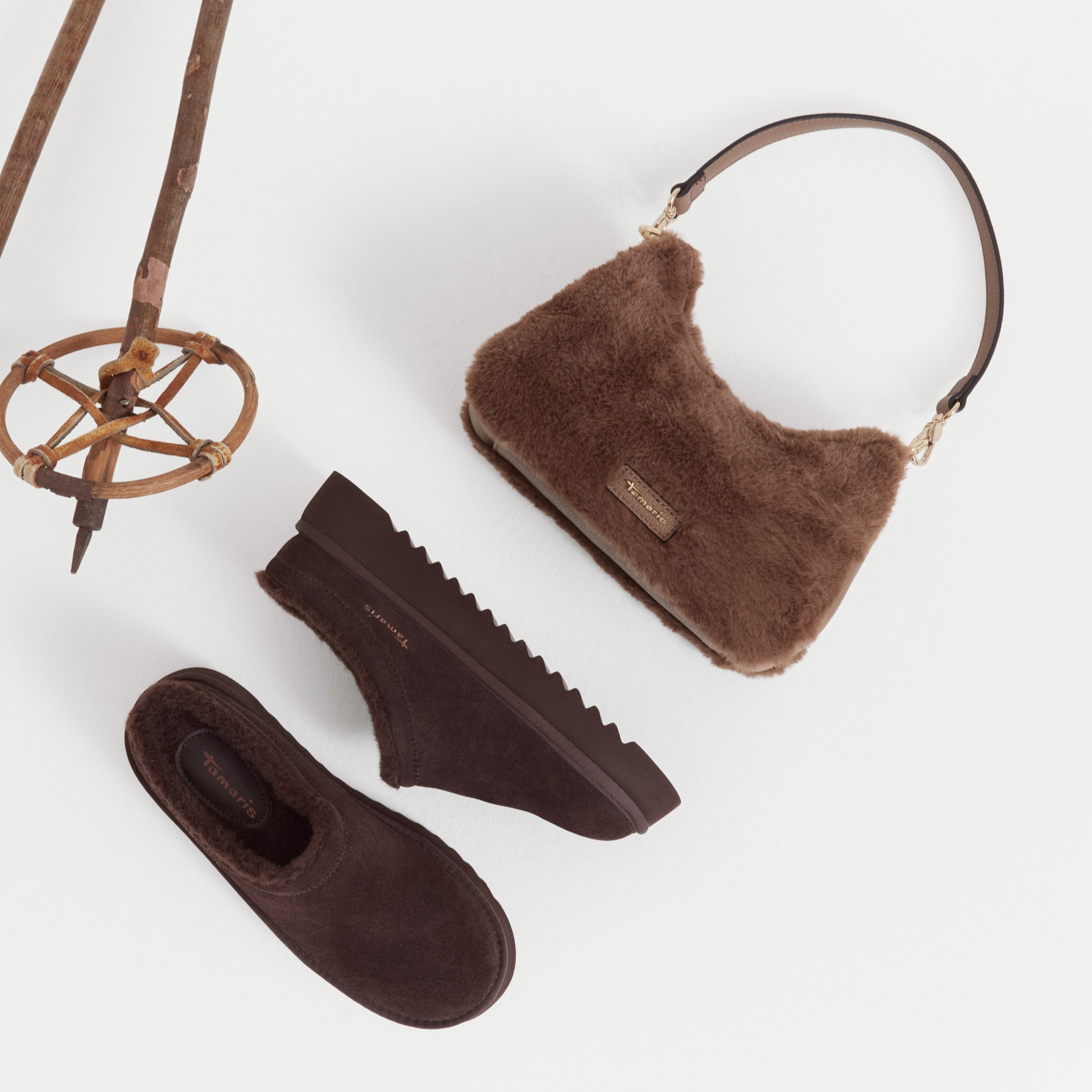 Brown mules and bag in fur on white background