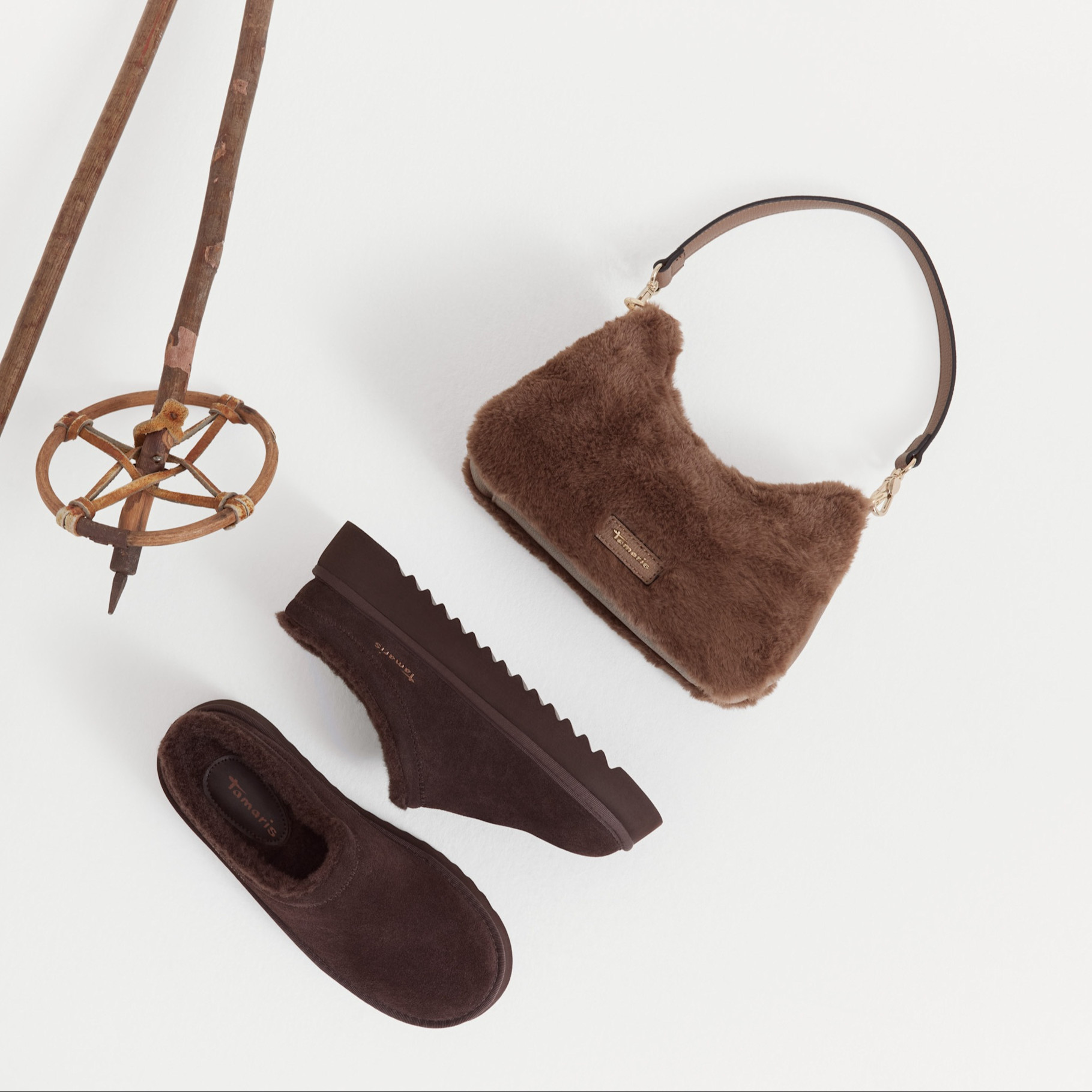 Brown mules and bag in fur on white background