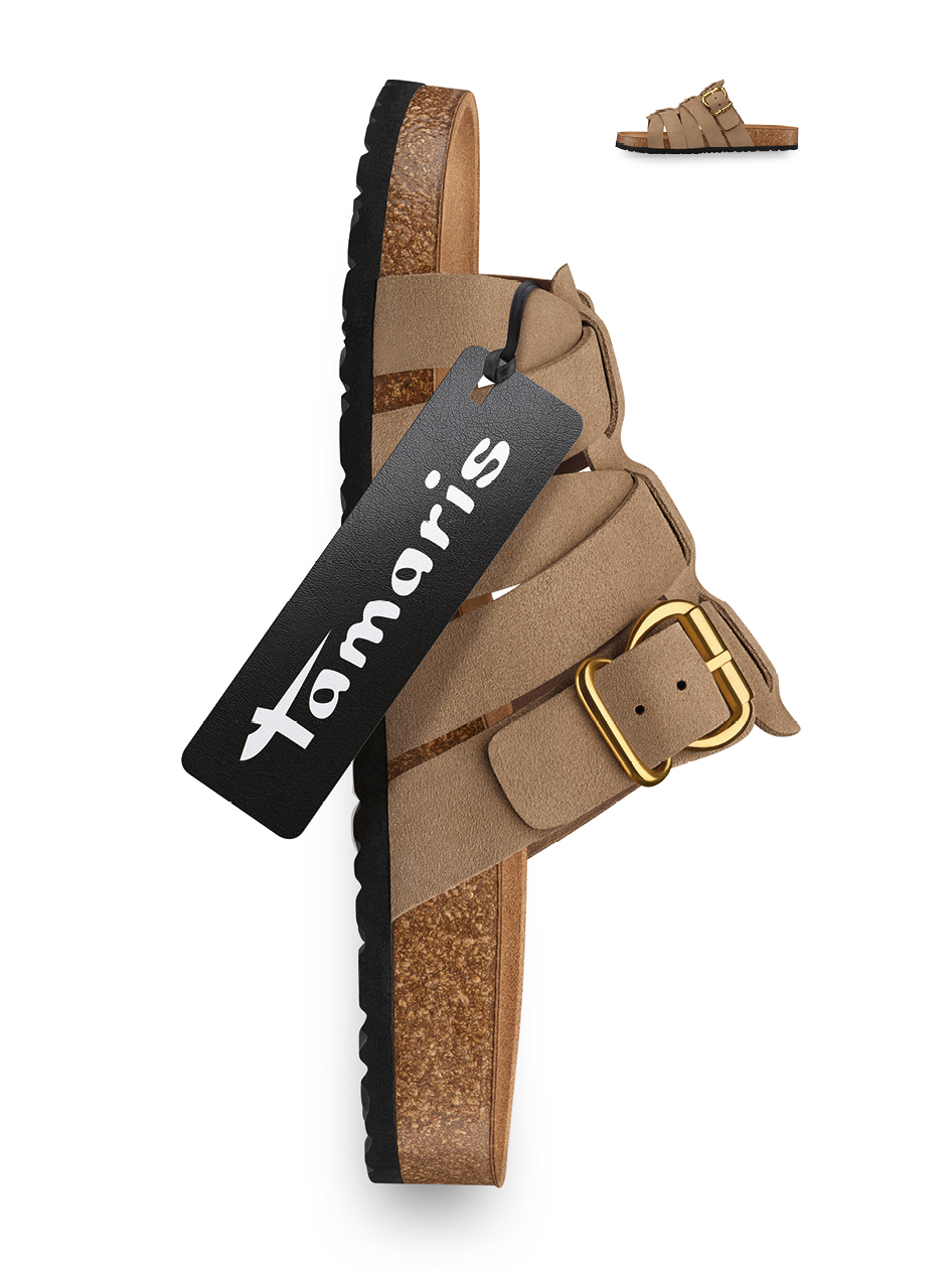 Beige Tamaris sandal with cork footbed, black sole, and gold buckle, with a black brand label.