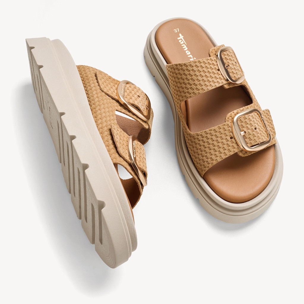 Tamaris platform sandals in beige with two straps, gold buckles and a thick white lug sole, shown from above and from the side.