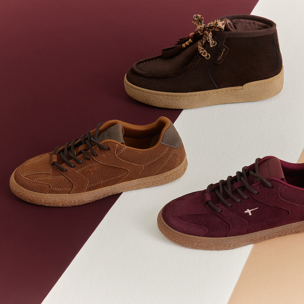 Three Tamaris shoes: a dark brown sneaker, a cognac-colored sneaker and a burgundy sneaker on a colorful background.